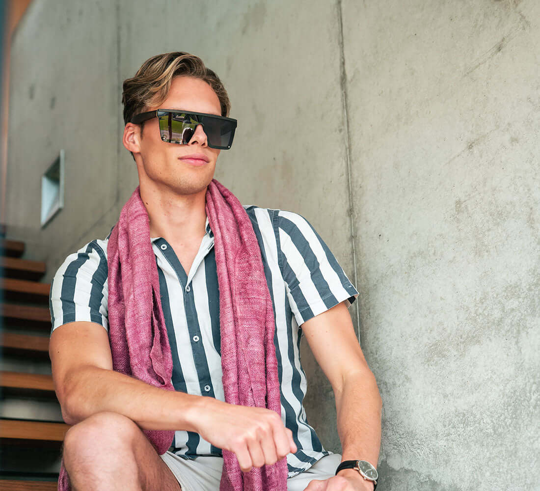 man in his checked shirt wearing sunglasses