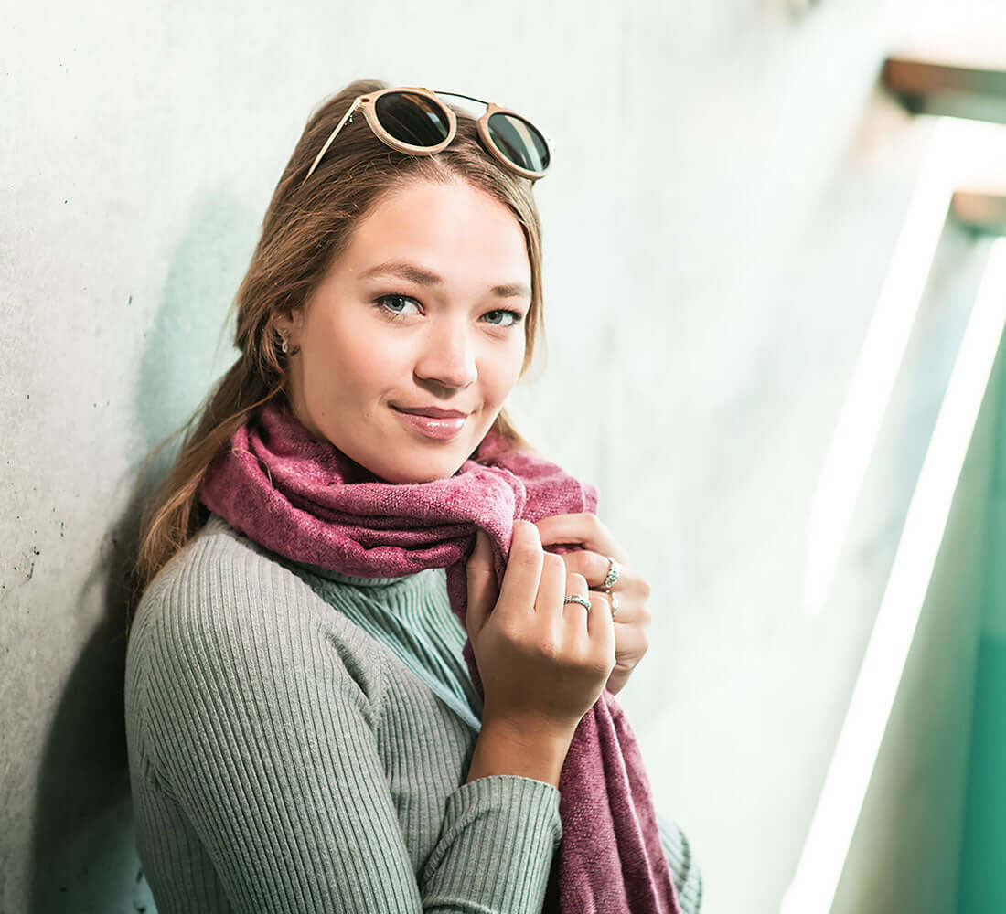 girl wrapped up in a pink stole