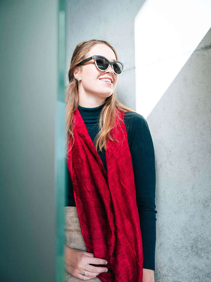 woman wearing wooden sunglasses