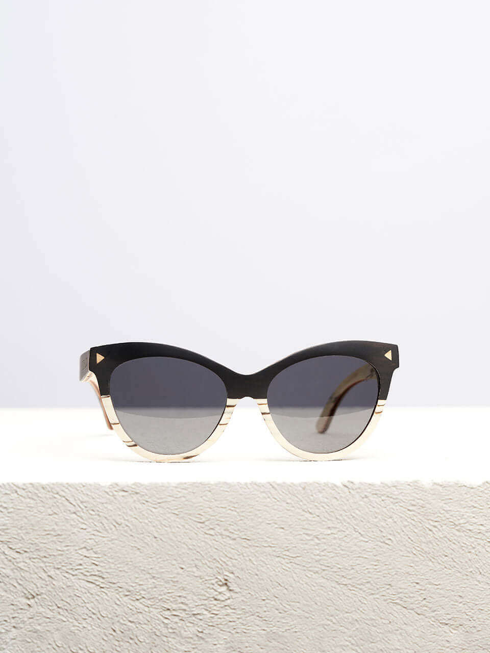 cat eye sunglasses kept on a white platform