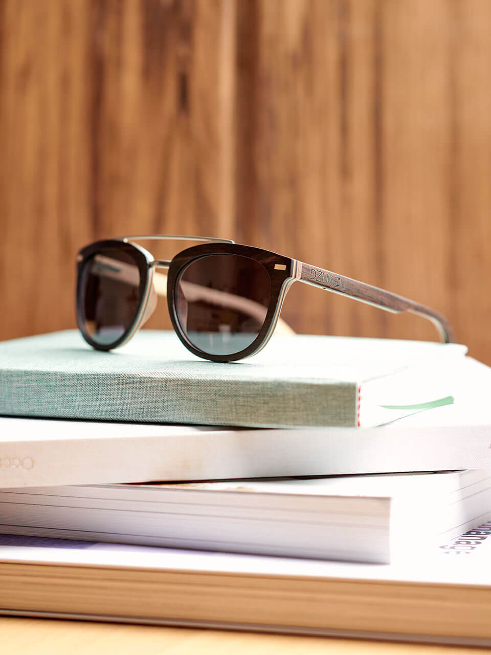 sunglasses kept on a pile of books